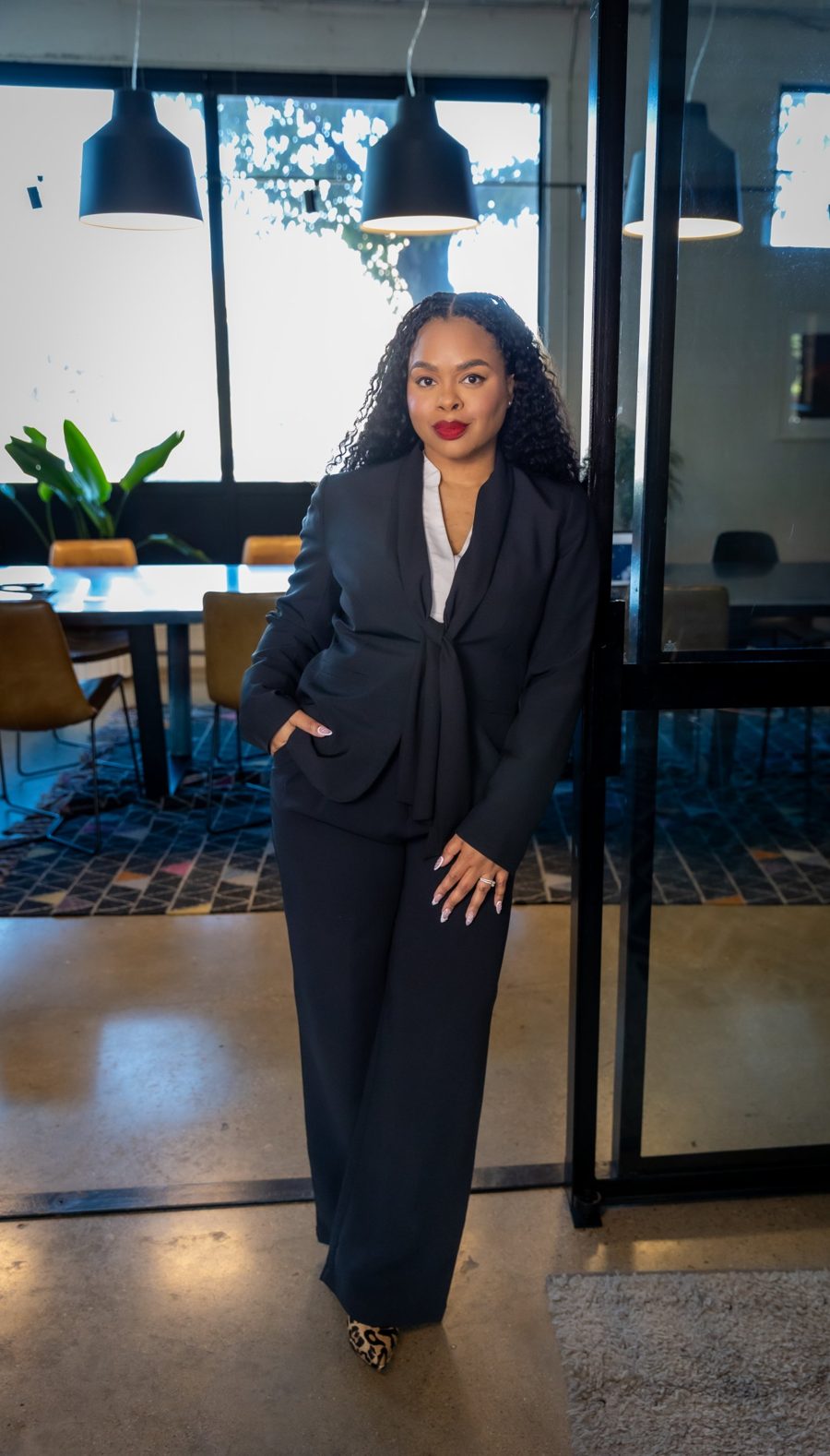 Attorney Jennifer N. Brantley standing in a navy suit in her office