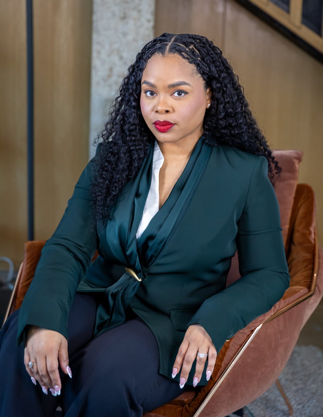 Attorney Jennifer Brantley seated in a green blazer