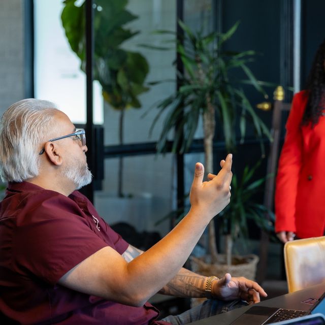 An attendee asking a question during the workshop.